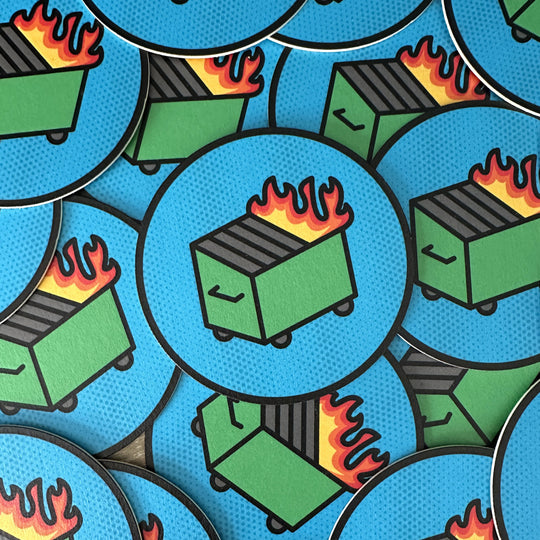 A pile of dumpster fire coasters