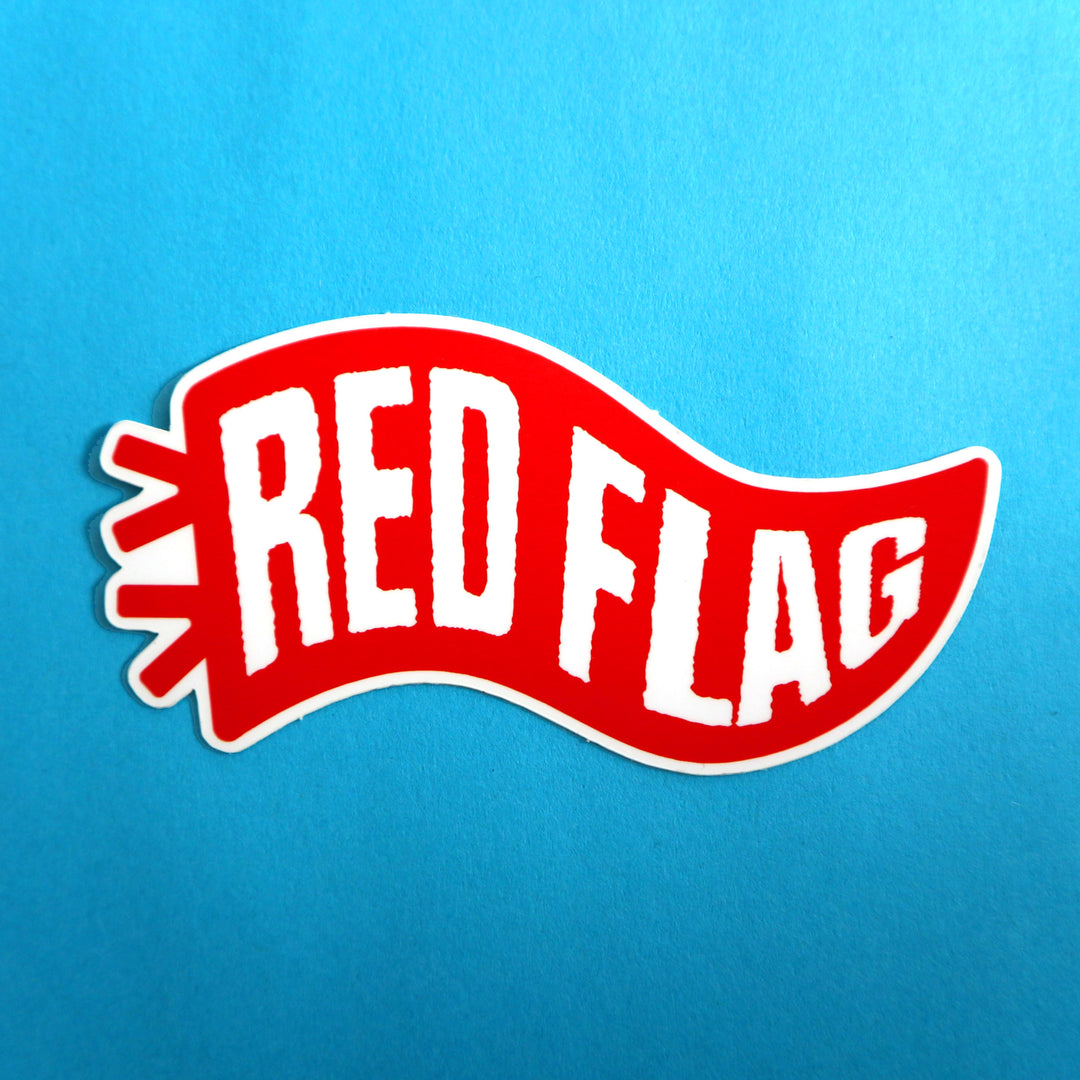 Red flag sticker on a blue background